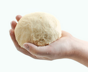 fresh raw dough in bakers hand
