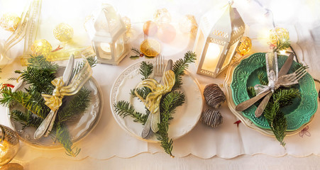 Christmas festive table setting decoration with tableware, ribbo