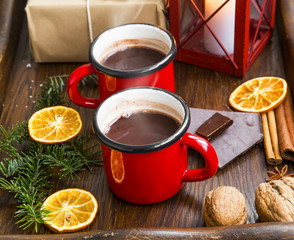 Winter hot chocolate cups with lantern and winter spices