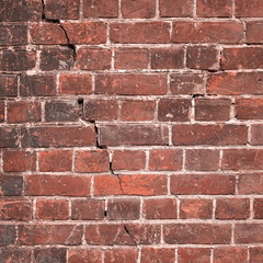 Obraz premium Cracked Grungy Old Red Clay Brick Wall Frame Background Texture