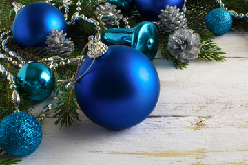 Christmas blue ornaments, silver beads and pine cones