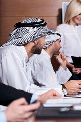 Positively delighted workers cooperating together
