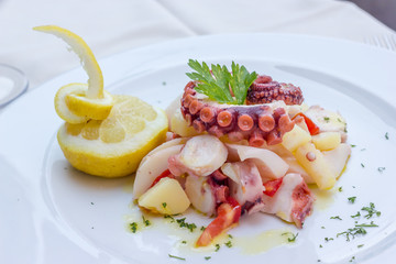 Appetizer of cuttlefish octopus and potatoes