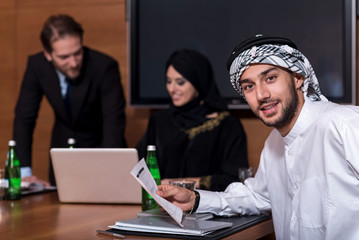 Positive delighted Arabian holding the document