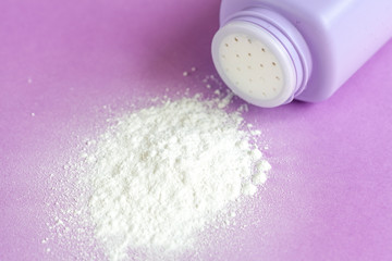 baby powder on purple background