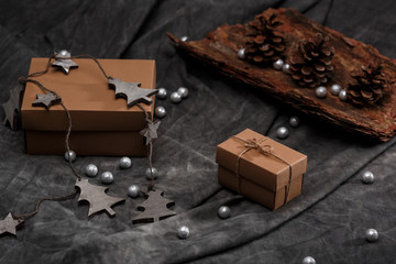 Christmas decoration and gift boxes over grey background.
