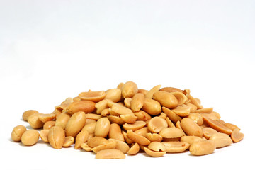 Pile of shelled and salted peanuts on white background. Horizontal.