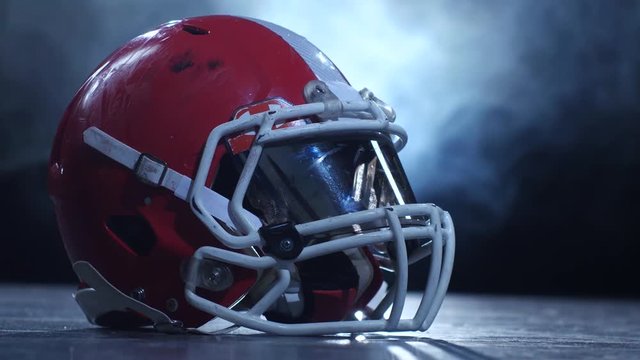 Helmet american football players in the smoke background. Clous up