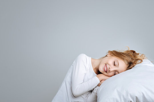 Delighted Cute Girl Pretending To Sleep