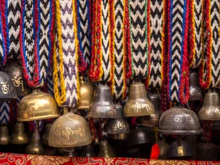 Wall murals Nepal Yak Bells on Colorful Knitted Ribbons