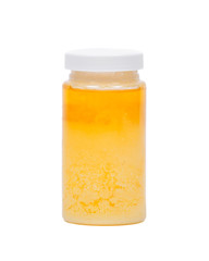 Clarified butter ghee in plastic jar isolated on white background