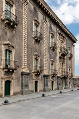 Fototapeta na wymiar 18th century facade of the Benedictine Monastery of San Nicolo l'Arena in Catania, Sicily, Italy, a jewel of the late Sicilian Baroque style.