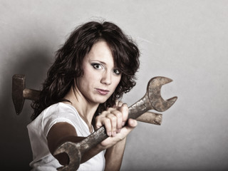 Sexy girl holding wrench spanner tool