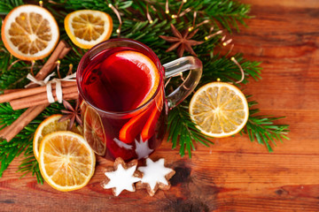 Christmas mulled wine with winter spices on dark wood. Top view.