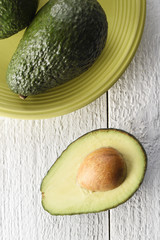 Freshly sliced avocado on a white background