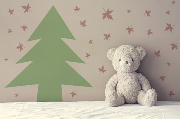 Fototapeta premium vintage teddy bear sit on the right side white bed at headboard