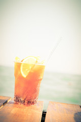 Concept of luxury tropical vacation. One Cuba Libre cocktail on