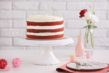 Delicious cake on white table