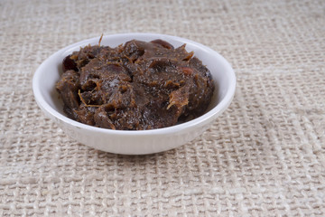 Tamarind paste on small bowl.