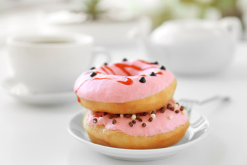 Delicious donuts on table closeup