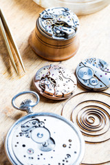 opened clocks and internals on a table