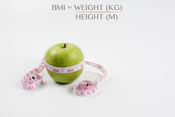 BMI concept with green apple.