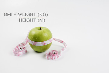 BMI concept with green apple.