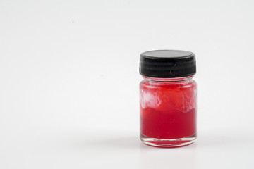 Red  balm in a jar isolated over white