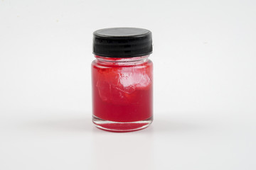 Red  balm in a jar isolated over white
