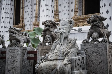 Naklejka premium Detail of Stone statue for Thai-Chinese style and thai art architecture in Wat Arun buddhist temple in Bangkok, Thailand.Photo taken on: 21 November , 2016