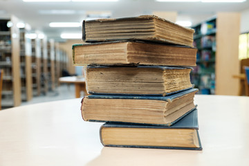 Stack of old books in library