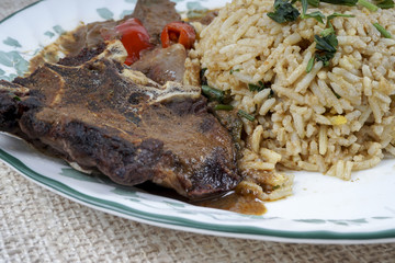 Mutton Byriani - Lamb and rice cooked with spices. Served with raita. Traditional South Asian Cuisine.