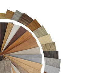 Laminate Wood Concept - Samples of laminate circle and vinyl floor tile on black wooden