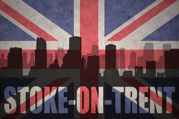 abstract silhouette of the city with text Stoke-on-Trent at the vintage british flag