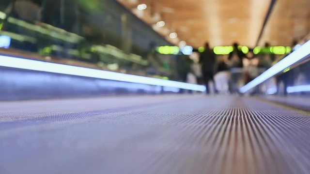 Moving sidewalk at an airport with people 2