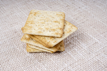 the cream cracker biscuit on the wooden background.