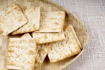 the cream cracker biscuit on the wooden background.