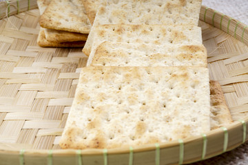 the cream cracker biscuit on the wooden background.
