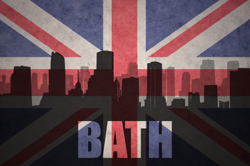 abstract silhouette of the city with text Bath at the vintage british flag