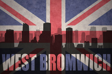 abstract silhouette of the city with text West Bromwich at the vintage british flag
