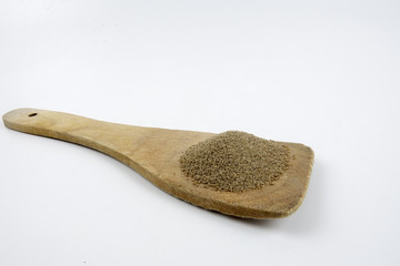 Pepper,Black pepper in Wooden spoon placed on white table