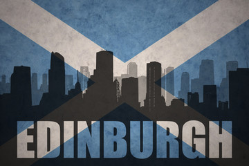 Fototapeta premium abstract silhouette of the city with text Edinburgh at the vintage scotland flag