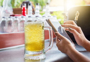glass of beer t the bar counter.
