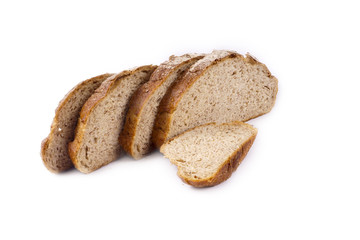 Fresh whole grain bread cut in half on white background