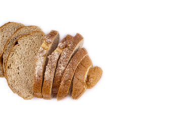 Fresh whole grain bread cut in half on white background