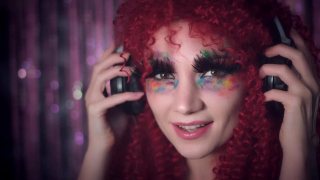 4k Disco Redhead Sexy Woman Putting on Black Headphones