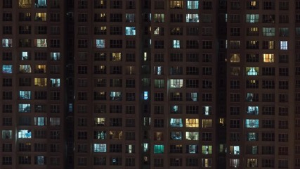 Timelapse of high-rise apartment block at night