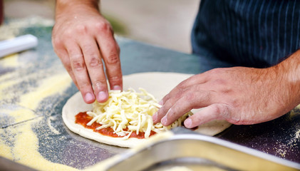 chef making pizza