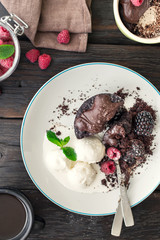 Chocolate cake with berries and ice cream