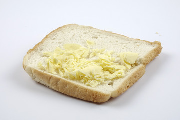 Fresh whole grain bread cut in half on white background